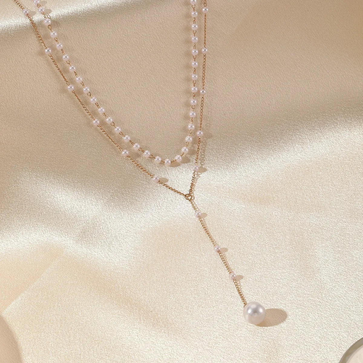 Gouden gelaagde ketting met parels | Luxe statement voor tijdloze elegantie
