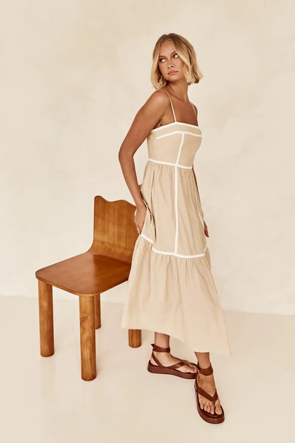 YVIE | Mouwloze Midi Jurk Met Contrastbiezen En Zwierige Rok – Licht, Elegant, Zomers