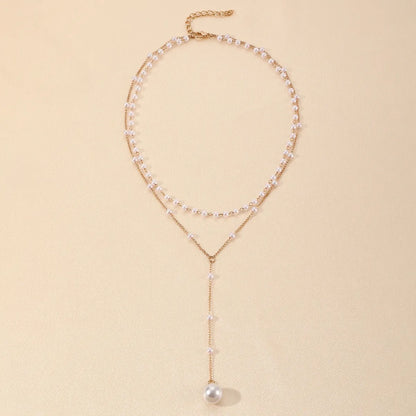 Gouden gelaagde ketting met parels | Luxe statement voor tijdloze elegantie